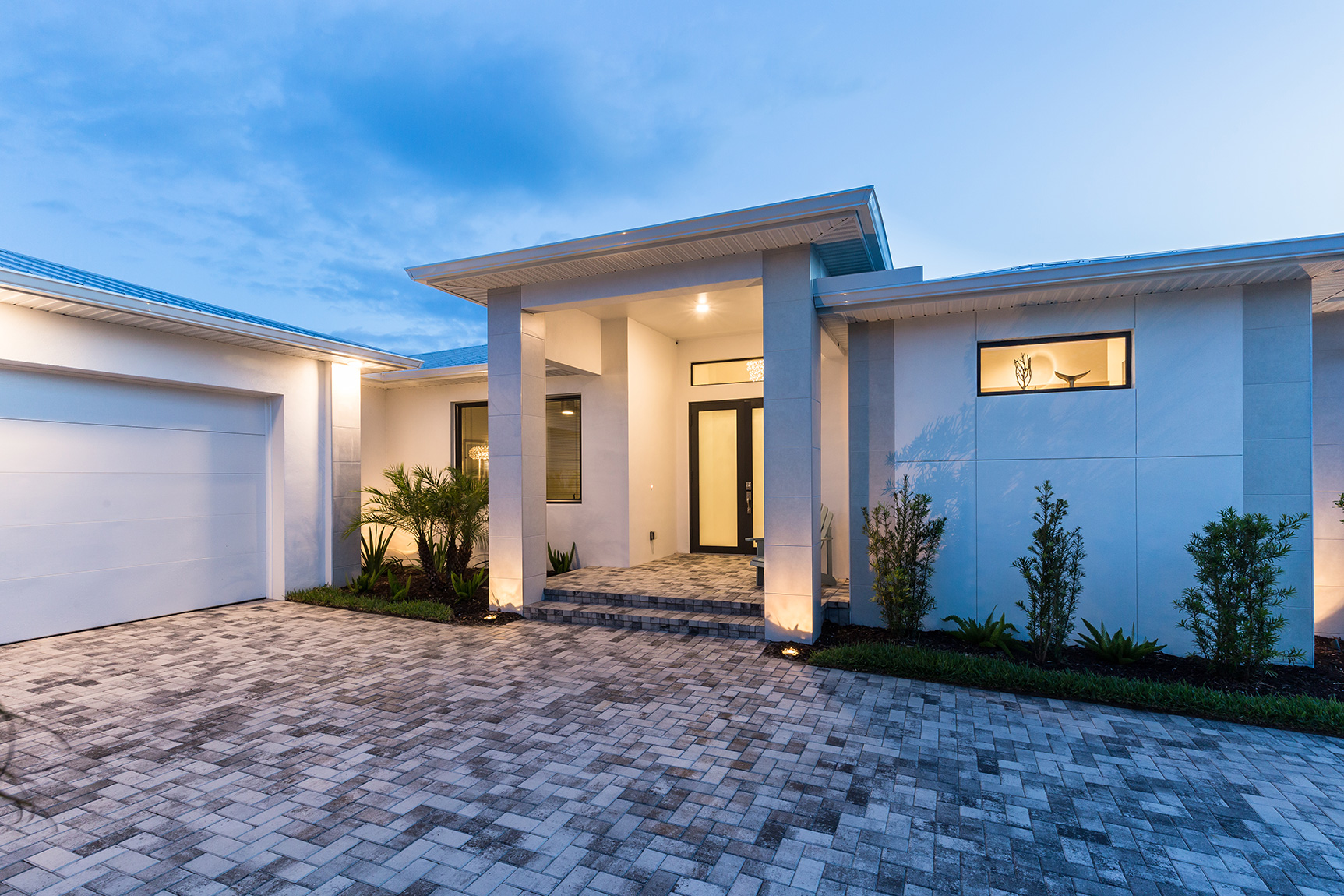 Modern custom home with paver driveway in Punta Gorda, Florida